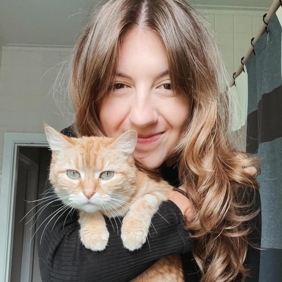 portrait of the photographer with her cat